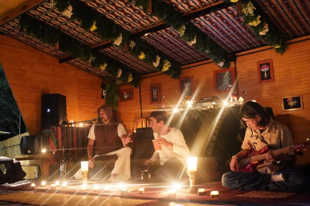 Musicians performing by candlelight at Eudemonia