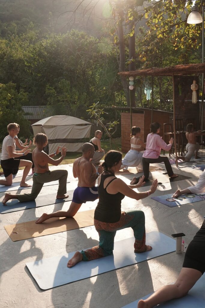 Guests practising outdoor yoga at Eudemonia